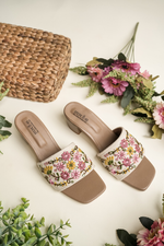 Beige Stepellas block heels featuring colorful pink and yellow floral embroidery.