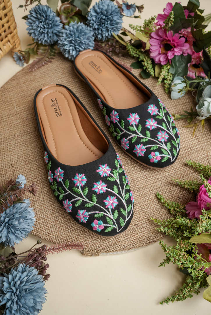 Black floral embroidered women juttis suitable for festive and wedding wear