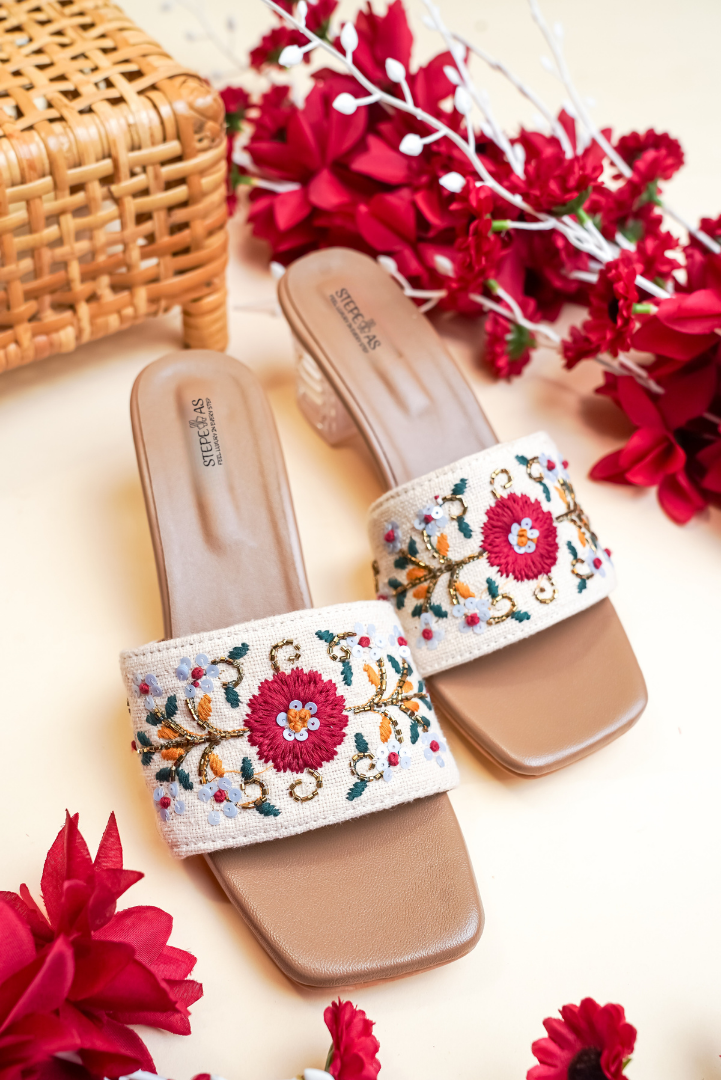 Stepellas black pointed-toe mules decorated with a sophisticated rose-gold leaf stud pattern.