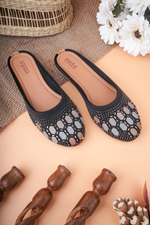 Designer Stepellas black block heels showcasing intricate hexagon Siroski stone work on the front.