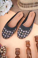 Stepellas black heeled mules featuring a unique fanned geometric Siroski stone design and cushioned soles.
