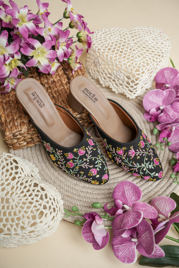 Designer Stepellas black pointed-toe heels with shimmering geometric Siroski stone work.