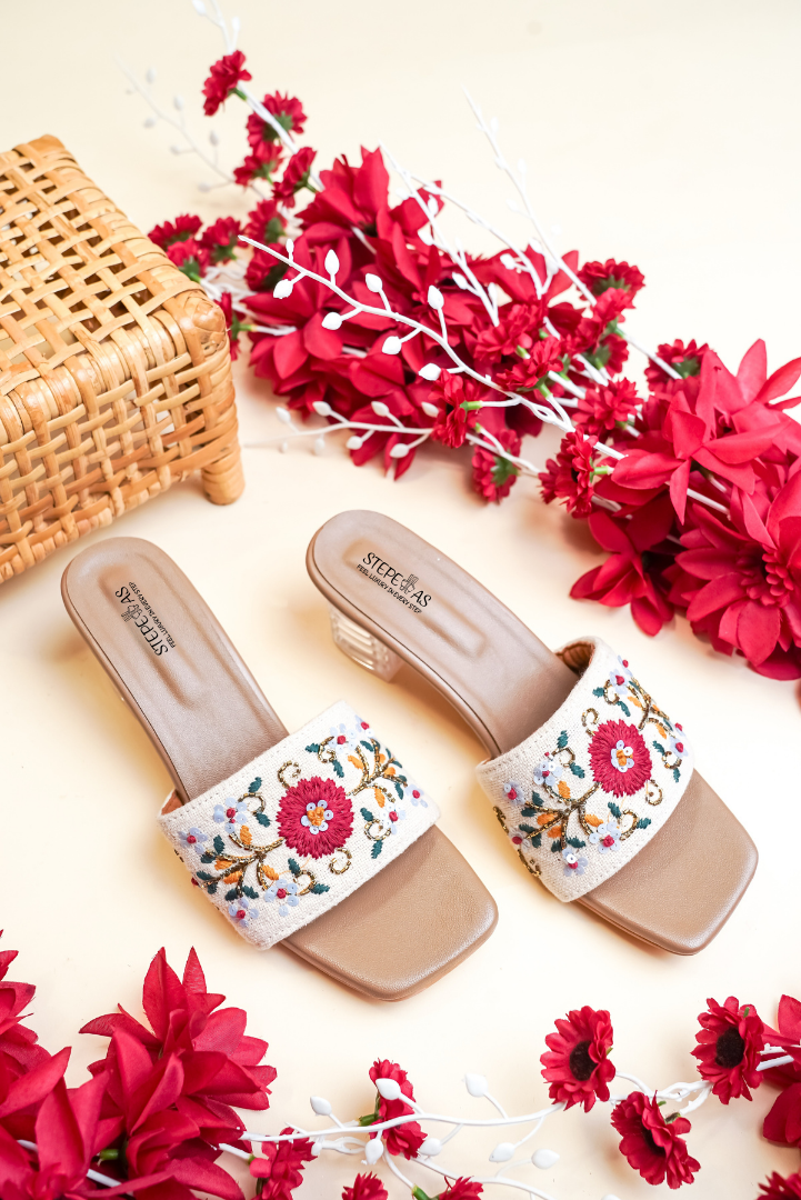 Stepellas black pointed-toe mules decorated with a sophisticated rose-gold leaf stud pattern.