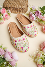 Cream floral embroidered women juttis by Stepellas with handcrafted detailing