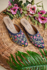 Top view of Stepellas branded blue embroidered heels highlighting the soft, padded tan insole for comfort.
