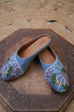 Close-up of the Stepellas branded cushioned insole on a black denim-style designer jutti.