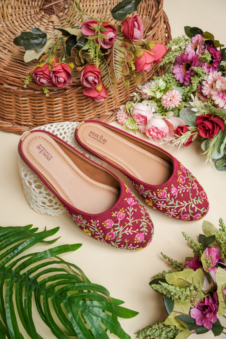 Top view of Stepellas branded maroon embroidered juttis highlighting the soft cushioned tan insole.