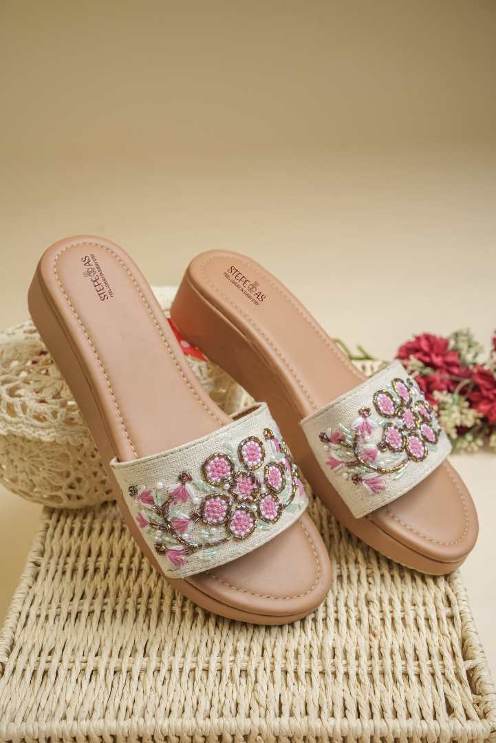 Top view of Stepellas beaded platform heels highlighting the branded tan cushioned footbed for comfort.