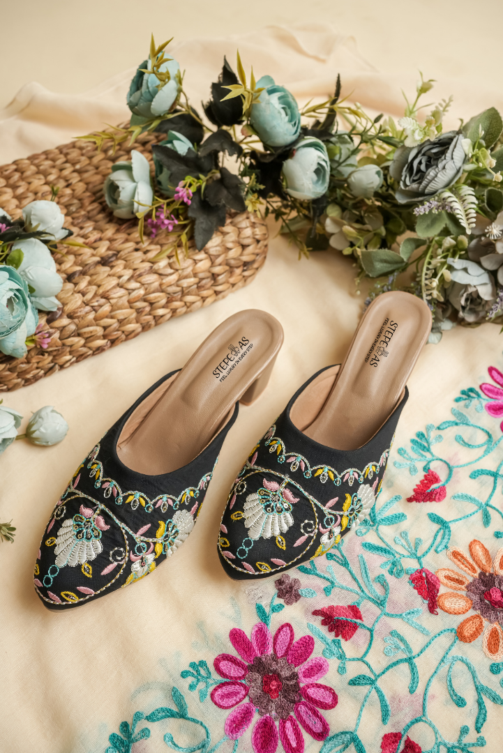 Beige Stepellas block heel sandals with pink floral embroidery and a square toe design.
