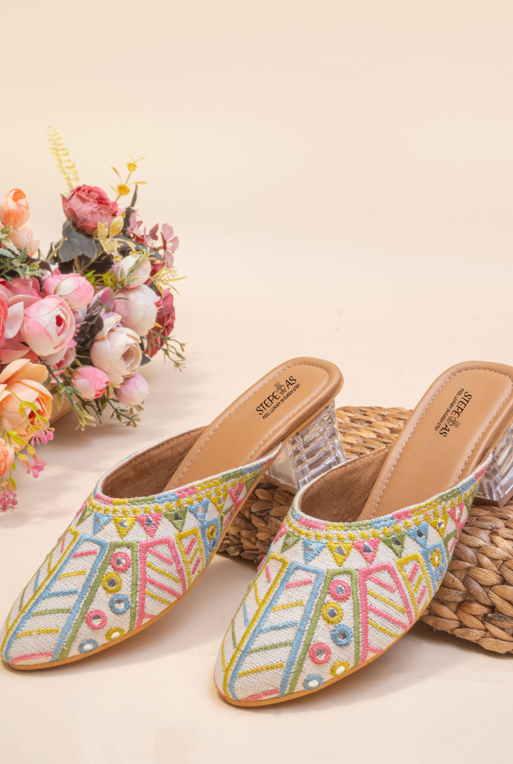 Side view of Stepellas white designer heels highlighting the stable transparent block heel and comfortable cushioned insole.