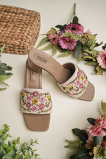 Pair of Stepellas designer heeled sandals with a square toe and cushioned brown sole.