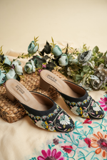 A collection of Stepellas branded ethnic footwear showing handcrafted details and cushioned soles.