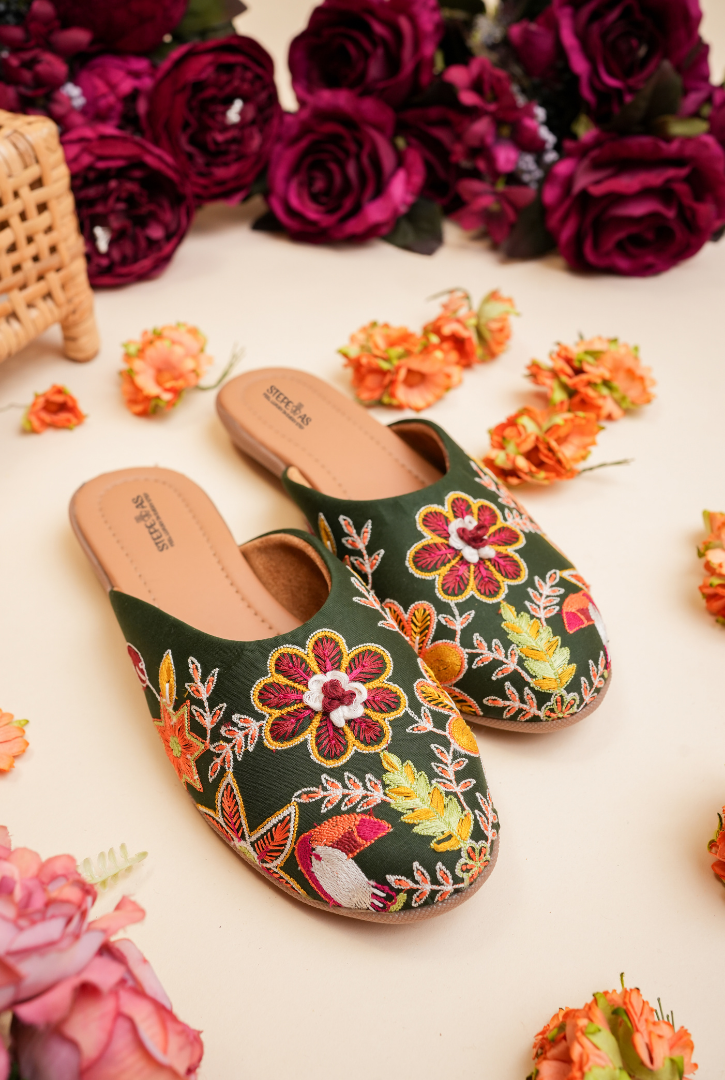 Handcrafted green embroidered women juttis by Stepellas