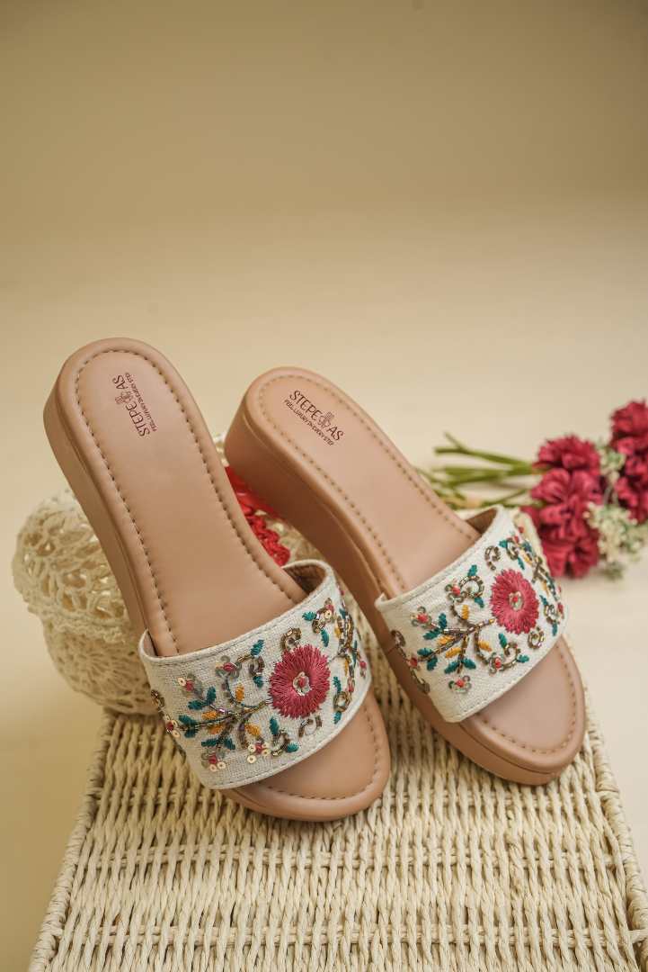 Designer Stepellas platform heels with a central maroon floral motif and golden sequin vine embroidery.