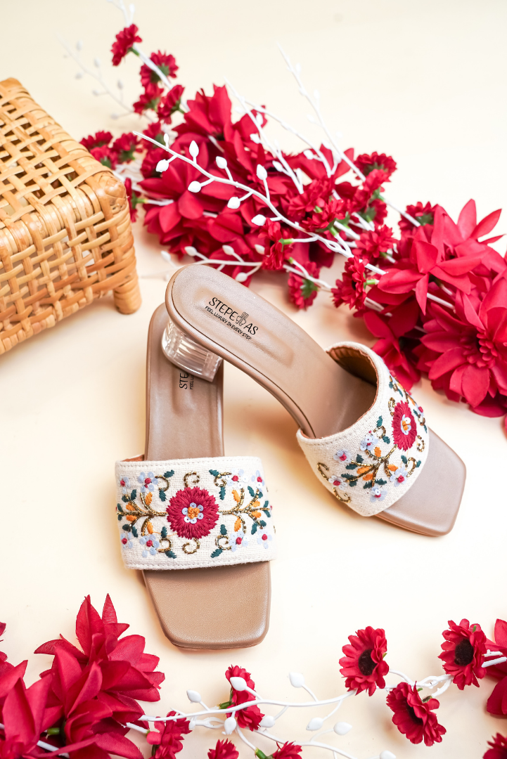 Deep maroon Stepellas heeled mules with yellow and pink floral vine threadwork.
