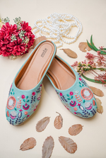 Pista green floral embroidered women juttis for festive and wedding wear