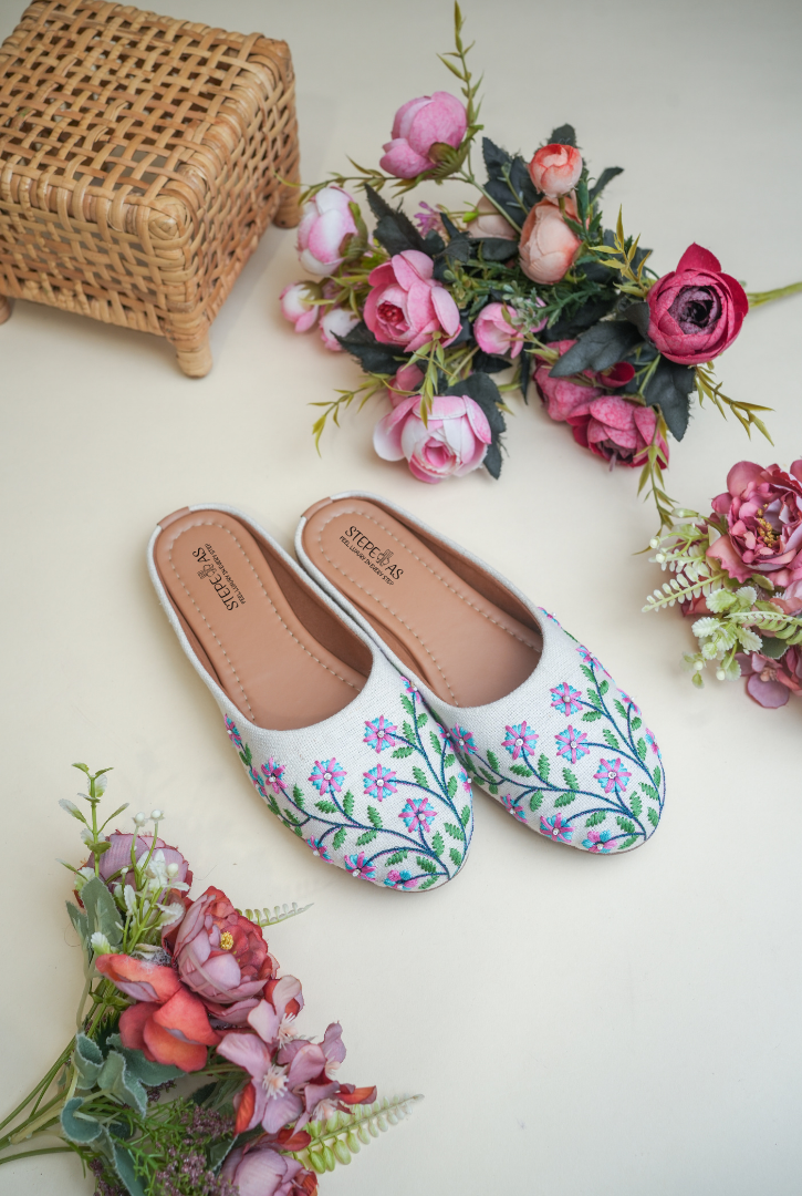 White floral embroidered women juttis handcrafted by Stepellas
