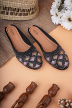 Detailed close-up of intricate fan-pattern embroidery on Stepellas traditional footwear.