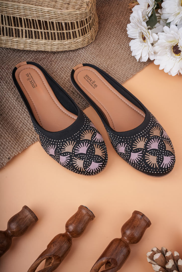 Detailed close-up of intricate fan-pattern embroidery on Stepellas traditional footwear.