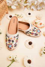 Off white floral embroidered women juttis suitable for festive and wedding wear