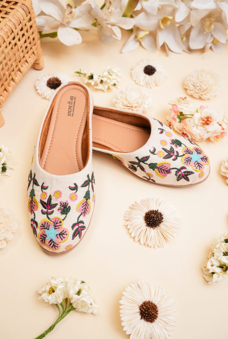 Off white floral embroidered women juttis suitable for festive and wedding wear