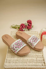 Designer Stepellas platform heels featuring multi-color yellow and pink floral hand-embroidery with beads.